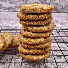 a stack of oatmeal cookies sitting on top of a cooling rack