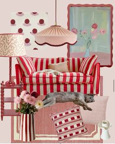 a dog laying on top of a red and white striped couch in a living room