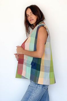 Parachute Vest from Marrakshi Life Sleeveless, open cotton vest in a rainbow plaid pattern Shawl collar, padded shoulders Two front pockets Relaxed, oversized fit 100% Cotton Hand woven in Marrakesh Model Measurements & Item Sizing: Model Height: 5'8” Model Size: US 2 / S / 26 Size shown on model: O/S Multicolor Cotton Vest For Spring, Multicolor Summer Outerwear With Pockets, Multicolor Cotton Outerwear For Summer, Sleeveless Multicolor Cotton Outerwear, Multicolor Sleeveless Cotton Outerwear, Marrakshi Life, Swim Jewelry, Rainbow Plaid, Brother Vellies