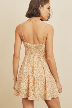 Another fun and flirty sundress to add to your summer wardrobe, our flare fitting Lily Floral cami mini dress is a sweet and soft style that's an absolute must for some outdoor summer fun. Complete with a square neckline, floral design, adjustable straps, smock detail on the back, and an A-line silhouette. Pair perfectly with strappy sandals. Model is 5'9" and wearing size Small. Fitted Sundress With Sweetheart Neckline For Summer, Cute Mini Dress With Smocked Bodice For Garden Party, Sweetheart Neckline Sundress For Brunch, Casual Mini Length Suspender Dress For Spring, Casual Mini Suspender Dress For Spring, Summer Floral Dress With Sweetheart Neckline For Brunch, Cute Mini Dress With Tie Straps, Spring Floral Print Mini Suspender Dress, Summer Suspender Dress With Sweetheart Neckline And Straps