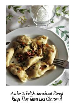 a white plate topped with ravioli next to a glass of water and a fork