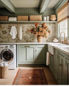 a washer and dryer in a room with floral wallpaper on the walls