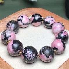 Material:pink rhodonite beads  size :18mm   quantity: one strand  6mm approx 29 pcs one strands 7mm approx25 pcs one strands 8mm approx 22 pcs one strands 9mm approx 21pcs one strands 10mm approx 19 pcs one strands 11mm approx 18pcs one strands 12mm approx 16 pcs one strands 13mm approx 16 pcs one strands 14mm approx 15 pcs one strands 15mm approx 14pcs one strands 16mm approx 14 pcs one strands 17mm approx 13pcs one strands 18mm approx 13pcs one strands 19mm approx 12pcs one strands 20mm approx Pink Polished Beaded Bracelets, Pink Polished Beads Bracelet, Pink Bracelets With Polished Beads, Pink Round Bracelets With Polished Beads, Pink Rhodonite, Beautiful Beaded Bracelet, Beads Bracelet, Bracelet Jewelry, Colour Tone