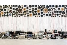 a room filled with lots of different types of electronics and wires hanging on the wall