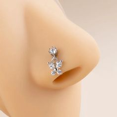 a close up view of an earring on a mannequin's head