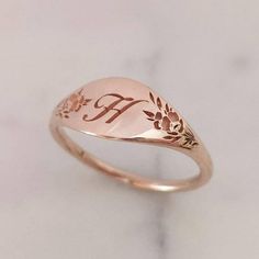 Elegant and unique 14k gold monogram signet ring, Vintage style floral initial ring, personalized engraved signet ring. * Band width: 1.5 mm, wide part width: 7 mm* Thickness: 1.5 mm* Available in 14K or 18K YELLOW, WHITE and ROSE gold.   The price listed is for 14K please contact me for 18K pricing.* Sizes vary from 5 US to 9 US, including half sizes.    Please choose your size upon checkout.* Please choose a the letter you would like to be engraved and mention in note to seller.* Please choose Elegant Rose Gold Engraved Ring Stamped 14k, Elegant 14k Gold Engraved Initials Ring, Elegant 14k Gold Initial Ring With Engraving Option, Luxury 14k Stamped Rose Gold Signet Ring, Luxury Engraved Rose Gold Signet Ring, Dainty Engraved Ring With Initials For Promise, Dainty Engraved Initials Promise Ring, Elegant Silver 14k Gold Initial Ring, Engraved Rose Gold Initial Ring Gift