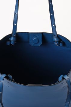 Matte sapphire blue calfskin large saddle bag Black contrast threading and oil-edge details Fold-over flap with magnetic closure Embossed logo Adjustable leather straps, suitable for both side-shoulder and crossbody carrying -------------- Bag size: approximately 16”W x 18”H x 3.5”D (35.5cm x 39.5cm x 8cm). Adjustable leather strap drop: approximately 8.5" to 18" (22cm to 46cm). Blue Textured Leather Satchel For Everyday Use, Blue Textured Leather Tote Shoulder Bag, Blue Textured Leather Everyday Shoulder Bag, Blue Textured Leather Shoulder Bag For Everyday, Designer Blue Satchel With Leather Handles, Blue Everyday Shoulder Bag With Textured Leather, Modern Blue Leather Satchel, Blue Calf Leather Bag With Detachable Strap, Blue Leather Shoulder Bag With Leather Lining