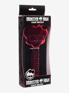 the monster hair brush in its packaging is red and has a skull on it's head