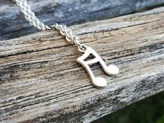 This little music note necklace would make a great gift. It is a sixteenth note. The charm and chain are a silver color. The note measures 1/2 inch and you can choose the length of the necklace. This would make a great gift for a birthday, an anniversary, Christmas or any other occasion. All jewelry items come in a gift box. Music-themed Charms Jewelry For Gifts, Music-themed Charm Jewelry As A Gift, Music-themed Charms Jewelry As Gift, Music-themed Jewelry Charms For Gifts, Silver Music-themed Necklace For Gift, Music-themed Pendant Necklaces As Gift, Music-themed Pendant Necklace As Gift, Music-themed Pendant Necklace, Musician Wedding