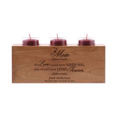 three candles in a wooden box with the words mom and two red candles on top