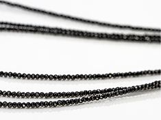 Black Spinel, 2mm round bead 3-strand rhodium over sterling silver necklace. Each strand measures approximately 1/16"W.  Lobster claw closure with 2 inch extender. Formal Multi-strand Faceted Bead Jewelry, Formal Double Strand Faceted Jewelry, Formal Double Strand Polished Beads Jewelry, Black Spinel, Sterling Silver Necklace, Lobster Claw, Sterling Silver Necklaces, Round Beads, Silver Necklace