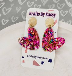 "These gorgeous glitter heart dangle earrings will have you ready for Valentine's day in no time! They're lightweight and great for all day wear! The design is cute for all year wear! Heart earrings are approximately 2\" long and assembled with hypoallergenic matte gold studs which are perfect for sensitive ears! Thank you for so much for stopping by my shop! Let me know if you have any questions or need help with anything- I am more than happy to help!" Trendy Heart Charm Earrings For Mother's Day, Heart Earrings For Mother's Day Party, Trendy Valentine's Day Party Earrings, Cute Heart Earrings For Valentine's Day Party, Trendy Dangle Heart Earrings For Valentine's Day, Trendy Handmade Heart Earrings For Valentine's Day, Trendy Heart Earrings For Valentine's Day, Heart-shaped Earrings For Valentine's Day Birthday, Cute Pink Heart Earrings For Mother's Day