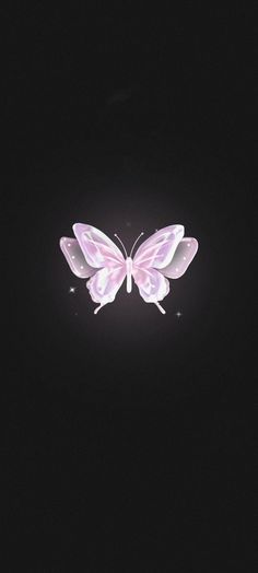 a pink butterfly flying through the dark sky