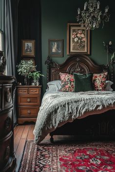 a bedroom with dark green walls and wooden furniture, including a bed covered in floral pillows