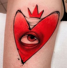 a heart with an eye and a crown on it's side is painted red