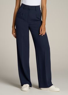 About Our Extra-Long Women’s Dress Pants Make a statement in these stylish pleated women’s tall dress pants. Pleated trousers are a timeless trend you’ll love and now, there’s finally a pair that will accentuate your long legs. These pants for tall women have been designed specifically for ladies between 5’9” and 6’6”, with a full length offering extra-long inseam options. They have a high-rise silhouette that gives the appearance of a cinched waist, complete with a fly zipper and hook and bar c Long Pants Women, Formal Pant Designs For Women, Straight Leg High Waist Pants, Pants For Mid Size Women, Navy Blue Pants Outfit Women Classy, High Rise Dress Pants Outfit, Tailor Trousers Women, Pants Trousers For Ladies, High Waist Trousers Women