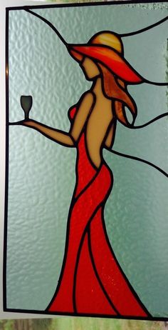 a stained glass window with a woman holding a wine glass in one hand and a bottle in the other