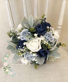 a bridal bouquet sitting on top of a chair