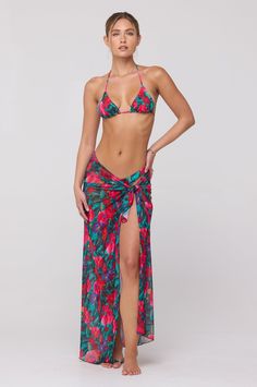 Transform your beach look with our Perfect Scarf Top and Sarong in Resort. This multifunctional piece effortlessly doubles as a chic scarf top and a stylish coverup sarong. From poolside to dinner, this versatile item will elevate your vacation wardrobe with its elegance and luxury. Multifunctional scarf top or sarong Fabric: 95% Polyester, 5% Spandex Machine wash cold on delicate cycle, air dry One size Measurements: 43" by 43" Made in Los Angeles Beachwear Wrap Cover-up For Vacation, Beach Season Triangle Top Cover-up, Wrap Swimwear For Beach Vacation, Beachy Wrap Swimwear For Vacation, Resort Season Beach Cover-up Swimwear, Beach Party Wrap Swimwear, Tropical Style Wrap Sarong For Beach Season, Beachwear Wrap Swimwear For Poolside, Tropical Tie-side Sarong For Spring