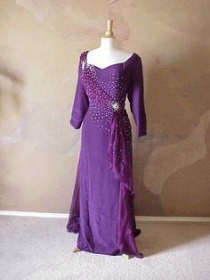 This purple 3/4 sleeve formal gown can be used as a #motherofthegroom #dress. You can modify this #design however you need. See other #dariuscordell #eveningdresses in our main catalog. Or we can make #custom #eveninggowns for the #motherofthebride as well.