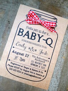 a baby - o announcement with a red bow on it