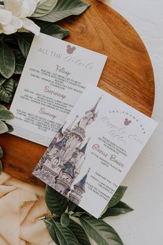 the wedding stationery is laid out on a table