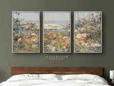 three paintings on the wall above a bed