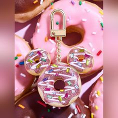 a mickey mouse keychain with donuts and sprinkles on it