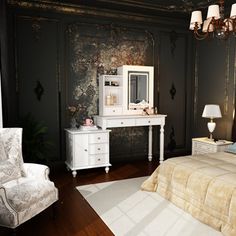 a bedroom with black walls and white furniture