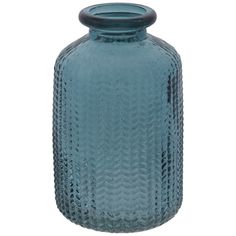 a blue glass vase sitting on top of a table