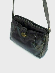 Etienne Aigner Vintage Classic Black Soft Leather two-Compartment Signature-Lined Shoulder Bag. Measures about: exterior -- 8" high x 12' long with a 3" wide base; signature lined main interior, secured by zipper, is 7" deep x 11" long and has a 4" deep x 7" long open pocket; the front exterior compartment, secured by a flap-clasp (Logo), is 6.5" deep x 10" long; the 3/4" wide leather strap has a 17" drop.               & Classic Leather Shoulder Bag With Lined Interior, Formal Vintage Soft Leather Shoulder Bag, Classic Shoulder Bag With Lined Interior For Daily Use, Vintage Soft Leather Bag For Formal Occasions, Formal Leather Bag With Lined Interior, Formal Rectangular Shoulder Bag With Lined Interior, Etienne Aigner, The 3, A 4