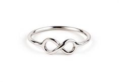 Infinity ring Gold solid. Promise jewelry classy. Promise forever to your loved one with this elegant ring that features the symbol of Infinity...  ◦ Made with Solid Gold ◦ Various gold colors & karats to choose ◦ Infinity's total Width: 0.5 cm (0.196 inches) x Length: 1 cm (0.393 inches) ◦ Band thickness: 1.2 mm (0.047 inches) This design is also available with birthstone: https://www.etsy.com/listing/669518510/yellow-gold-infinity-ring-blue-topaz In case you don΄t know your ring size, you can Elegant Infinity Stackable Rings, Modern Infinity Stackable Rings For Anniversary, Gold Infinity Ring, Jewelry Classy, Promise Jewelry, Engagement Ring Prices, Infinity Ring, Gold Colors, Ring Blue