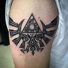 a black and white tattoo on the leg of a man