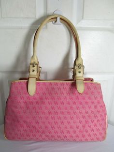 DOONEY & BOURKE  PINK MONOGRAM DB LOGO JACQUARD CANVAS/LEATHER   SHOULDER BAG NO ORIGINAL RECEIPT, NO BOX, NO DUST BAG    BRAND: DOONEY & BOURKE STYLE: SHOULDER TOTE COLOR: PINK MATERIAL:  JACQUARD CANVAS/LEATHER LINING: FABRIC SIZE:  14" x 9½" H x 4" D CLOSURE: MIDDLE TOP ZIP + 2 BUTTONS  INTERIOR: 3 OPENINGS,1 ZIPPED POCKETS, PHONE POCKET, KEY CLIP    APPROXIMATE MEASUREMENTS:  BAG DEPTH: APPROXIMATELY 4" BAG LENGTH: APPROXIMATELY 14" BAG HEIGHT: APPROXIMATELY 9½"  STRAP DROP: APPROXIMATELY 10 Pink Monogram Canvas Rectangular Shoulder Bag, Pink Rectangular Monogram Canvas Shoulder Bag, Pink Vintage Shoulder Bag, Pink Monogram Canvas Shoulder Bag For Daily Use, Pink Monogram Canvas Shoulder Bag For Shopping, Pink Monogram Canvas Shoulder Bag For Travel, Vintage Pink Shoulder Bag With Handles, Pink Vintage Shoulder Bag With Handles, Designer Pink Coated Canvas Shoulder Bag