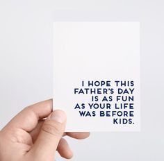 a hand holding up a card that says i hope this father's day is as fun as your life was before kids