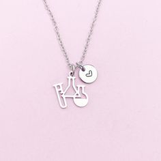 a silver necklace with a bicycle charm on it