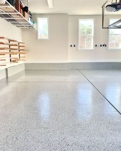 an empty basketball court with no people in it and shelves on the wall to the side