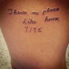 the back of a woman's leg with writing on it that says, there is no place like home