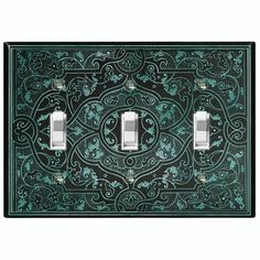 two light switch covers with an intricate design on the front and back cover in green