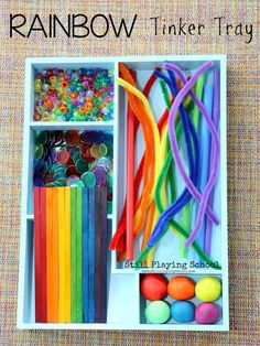 rainbow tinker tray filled with lots of different colored items