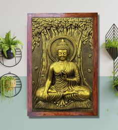 a golden buddha statue sitting on top of a wooden shelf next to potted plants