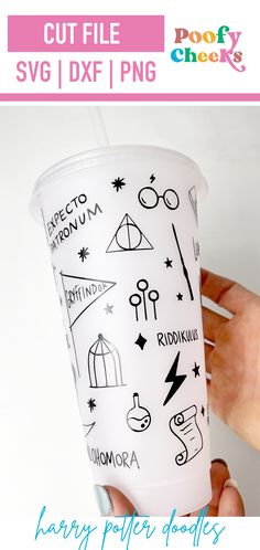 someone is holding up a cup with drawings on it and the words harry potter written on it