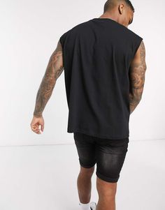 Tank Top by ASOS DESIGN Black Sleeveless T-shirt For Streetwear, Black Oversized Sleeveless Top, Oversized Sleeveless Black Top, Casual Black Tank Top With Dropped Armholes, Black Casual Muscle Tee With Dropped Armholes, Black Relaxed Fit Tank Muscle Tee, Casual Black Muscle Tee With Dropped Armholes, Relaxed Fit Black Muscle Tank Tee, Black Muscle Tee With Dropped Armholes