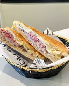 a cut in half sandwich sitting on top of a basket