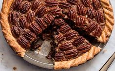 a pecan pie with one slice cut out