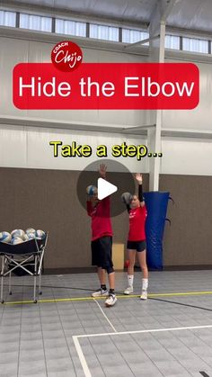 two people standing on top of a basketball court