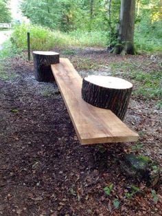 an image of a wooden bench made out of tree stumps in the woods on facebook