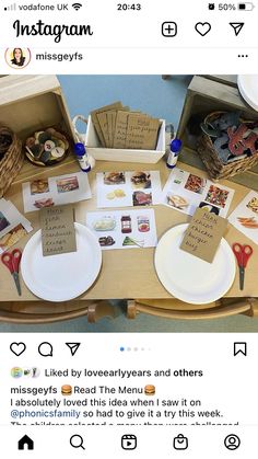 the table is set up with cards, plates and napkins for someone's special occasion