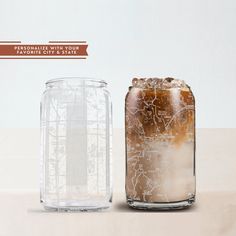 two glass jars filled with ice and brown liquid