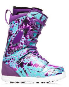 a purple and blue snowboard boot on a white background